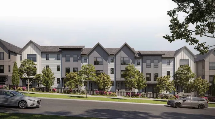 Artist’s rendering of Gradience townhome rows along a street, with white and grey siding, gabled roofs and trees