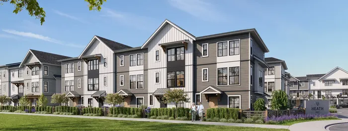Artist’s rendering of Heath West townhome rows in a modern farmhouse style, white and grey siding with dark trim and gabled roofs, behind a lawn