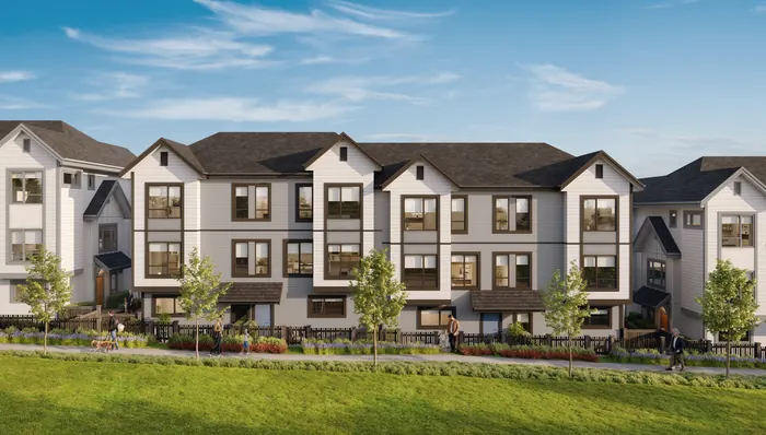 Artist’s rendering of a row of three-storey Nature Haus townhomes with white siding, dark gables and trim, and a lawn in front