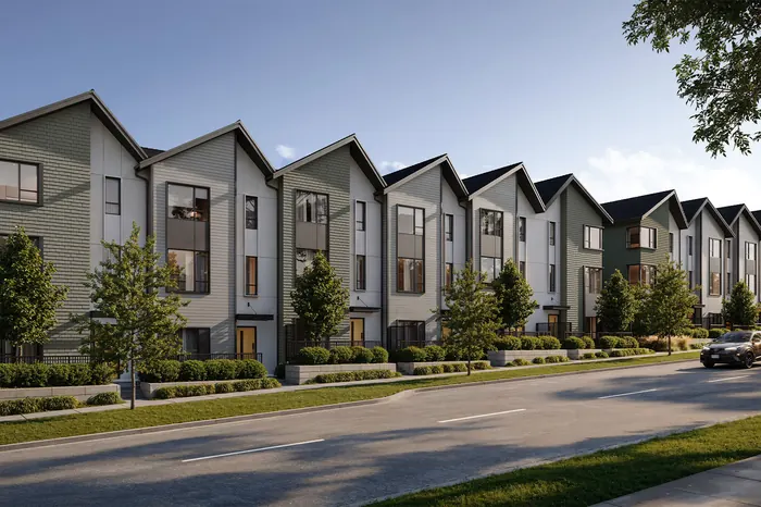 Artist’s rendering of a row of three-storey saltbox townhomes in green and grey siding along a landscaped street