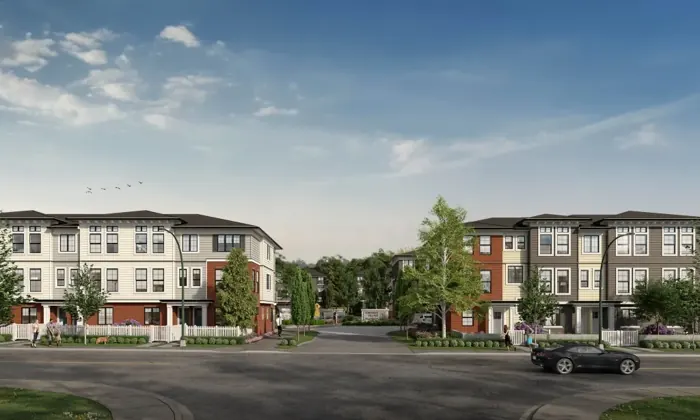 Artist’s rendering of three-storey Townside Village townhomes with red brick bases and white picket fences either side of the tree-lined entry street